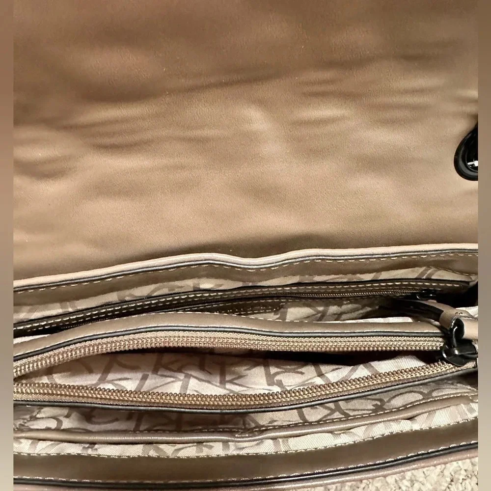Calvin Klein logo purse. Leather and chain strap. Taupe color, 3 compartments